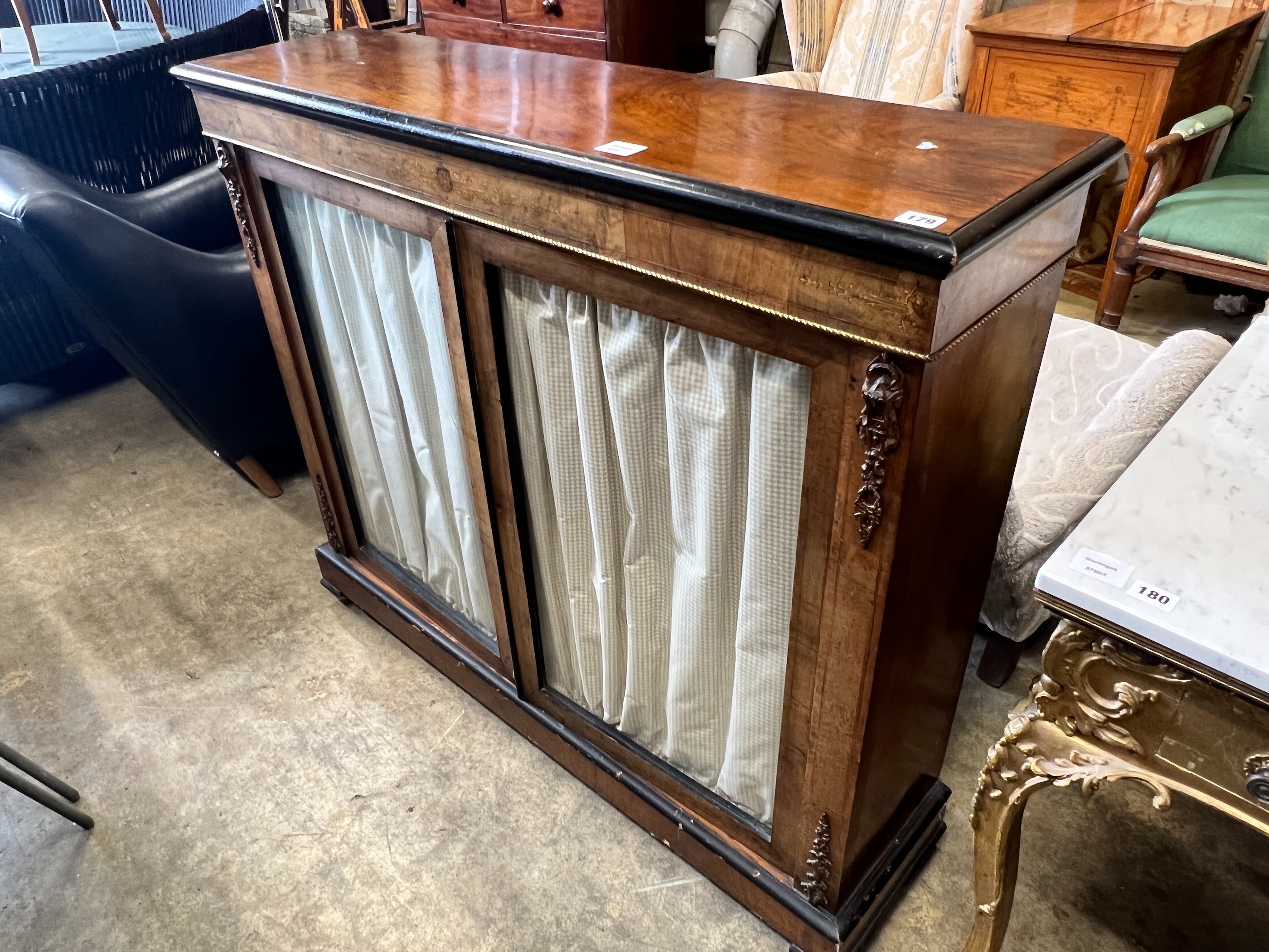 A Victorian gilt metal mounted inlaid walnut two door pier cabinet, width 121cm, depth 32cm, height 105cm